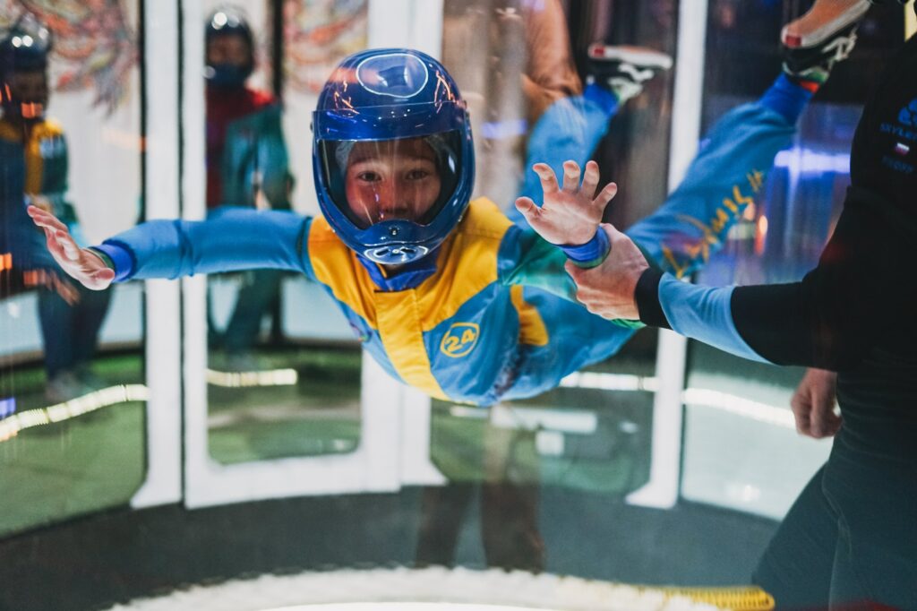 Tween boy flies in an air tube